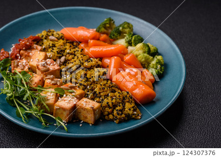 Quinoa bowl with tofu, steamed vegetables, grains, seeds and spices 124307376