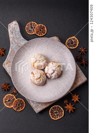 Delicious round freshly baked lemon flavored cookies Delicious round freshly baked lemon flavored cookies 124307409