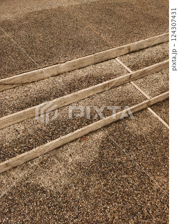 Stone steps providing access in an outdoor setting in bibione, italy, showcasing italian architecture and design Stone steps providing access in an outdoor setting in bibione, italy, showcasing italian architecture and design 124307431