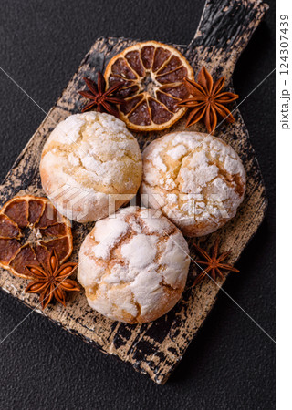 Delicious round freshly baked lemon flavored cookies Delicious round freshly baked lemon flavored cookies 124307439