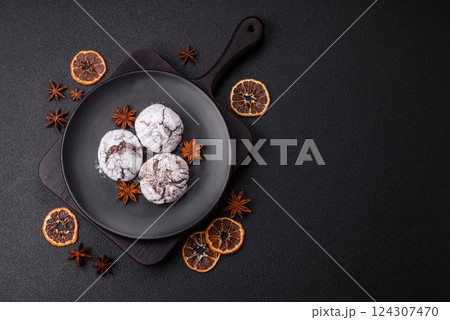 Delicious round freshly baked chocolate flavored cookies Delicious round freshly baked chocolate flavored cookies 124307470