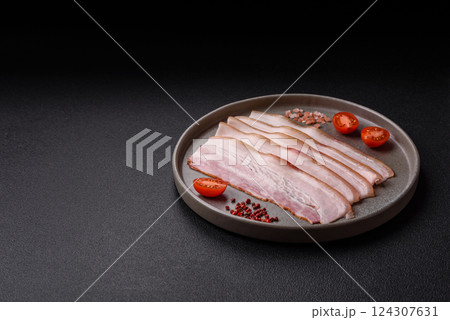 Fresh raw bacon sliced with spices and herbs Fresh raw bacon sliced with spices and herbs 124307631