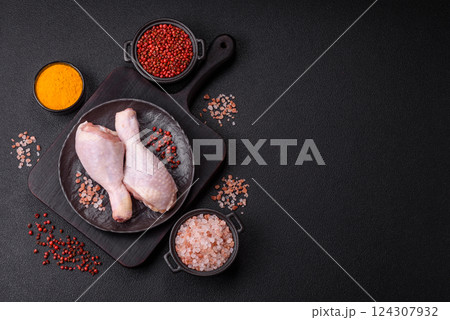 Raw chicken legs with salt, spices and herbs Raw chicken legs with salt, spices and herbs 124307932
