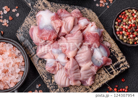 Raw chicken or turkey stomach with salt, spices and herbs Raw chicken or turkey stomach with salt, spices and herbs 124307954