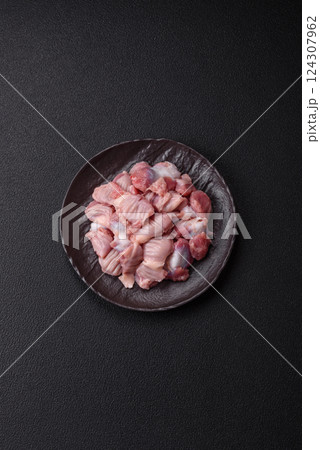 Raw chicken or turkey stomach with salt, spices and herbs 124307962