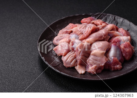 Raw chicken or turkey stomach with salt, spices and herbs 124307963