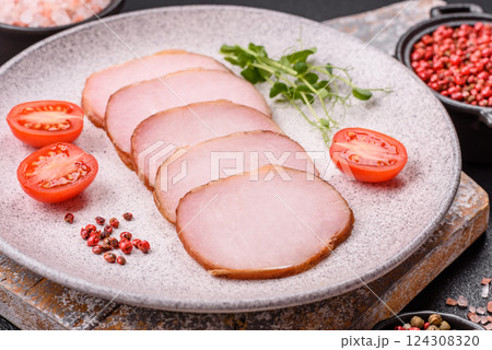 Meat, smoked, ham sliced with salt, spices and herbs 124308320