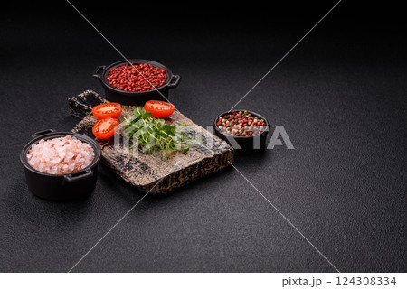 Sprigs of green fresh microgreen peas on wooden cutting board 124308334
