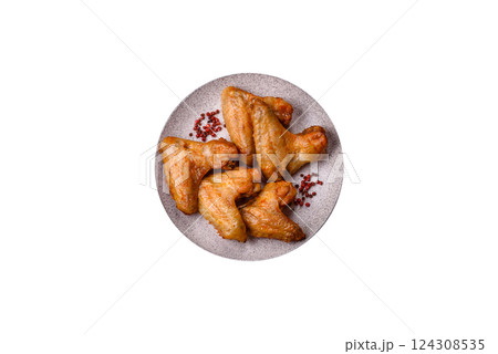 Grilled chicken wings with salt and spices Grilled chicken wings with salt and spices 124308535