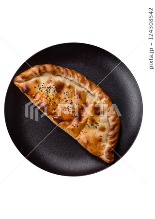 Cheburek meat pastry pie with herbs on the white background 124308542