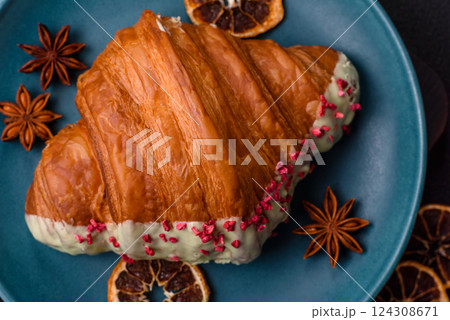 Crispy sweet red croissant with pistachio, raspberry and strawberry Crispy sweet red croissant with pistachio, raspberry and strawberry 124308671