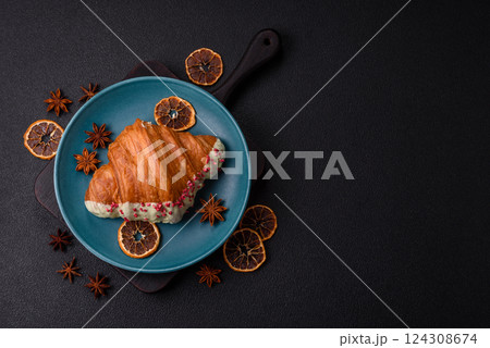 Crispy sweet red croissant with pistachio, raspberry and strawberry 124308674