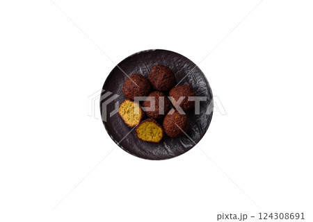 Fried chickpea falafel balls with salt, spices and herbs Fried chickpea falafel balls with salt, spices and herbs 124308691