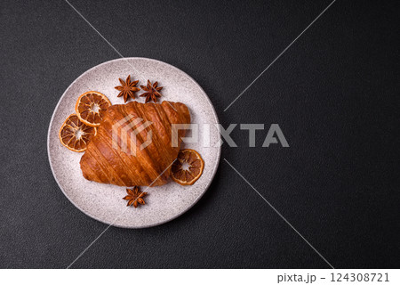 Sweet fresh crispy croissant with chocolate filling 124308721