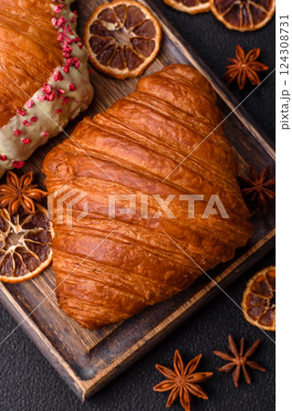 Sweet fresh crispy croissant with chocolate filling 124308731