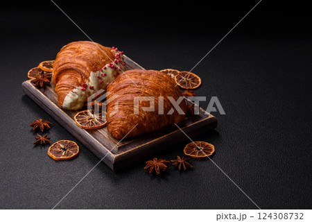 Sweet fresh crispy croissant with chocolate filling Sweet fresh crispy croissant with chocolate filling 124308732