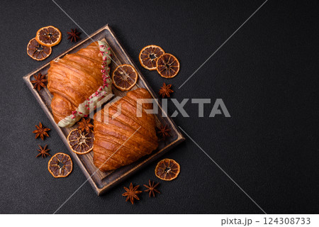 Sweet fresh crispy croissant with chocolate filling 124308733