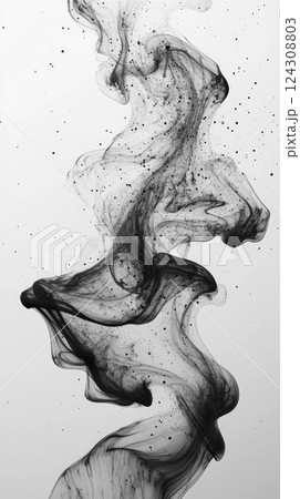 Swirling black ink creates stunning abstract patterns on a white background showcasing fluidity and motion 124308803