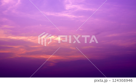 Beautiful pastel pink, orange and purple gradient sky background in the evening as the sun sets. Calm winter evening sky. Quiet evening sky atmosphere. Beautiful pastel pink, orange and purple gradient sky background in the evening as the sun sets. Calm winter evening sky. Quiet evening sky atmosphere. 124308946