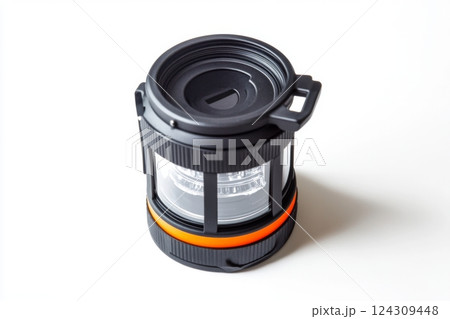 A modern portable camping lantern with a sleek design. This versatile light source is ideal for outdoor adventures. Stay bright and safe while camping. Generative AI A modern portable camping lantern with a sleek design. This versatile light source is ideal for outdoor adventures. Stay bright and safe while camping. Generative AI 124309448