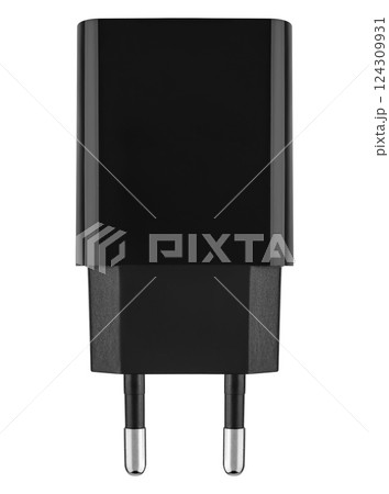 Compact black power adapter for charging smartphones and tablets. Compact black power adapter for charging smartphones and tablets. 124309931