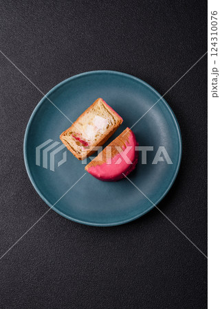 Round sweet New York roll croissant with raspberry cream filling Round sweet New York roll croissant with raspberry cream filling 124310076