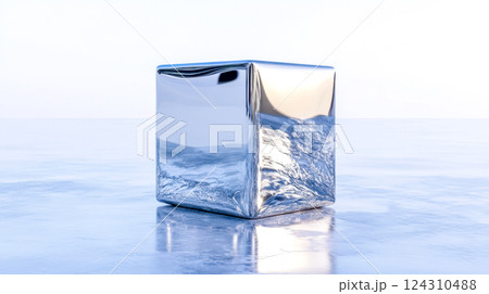 Chrome cube reflecting water surface on reflective floor 124310488