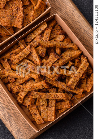 Crispy homemade brown bread crackers or croutons with seeds and grains 124311109