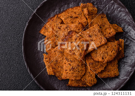 Crispy homemade brown bread chips with seeds and grains 124311131