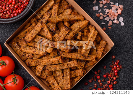 Crispy homemade brown bread crackers or croutons with seeds and grains Crispy homemade brown bread crackers or croutons with seeds and grains 124311146