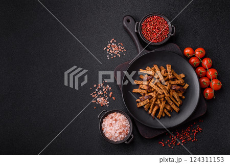 Crispy homemade brown bread crackers or croutons with seeds and grains Crispy homemade brown bread crackers or croutons with seeds and grains 124311153