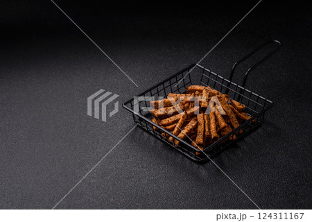 Crispy homemade brown bread crackers or croutons with seeds and grains Crispy homemade brown bread crackers or croutons with seeds and grains 124311167
