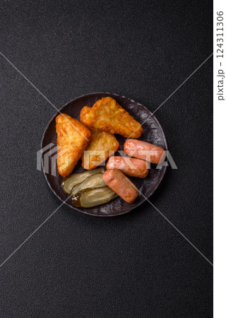 Hash browns with potatoes and onions, salt and spices 124311306