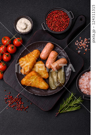 Hash browns with potatoes and onions, salt and spices Hash browns with potatoes and onions, salt and spices 124311315