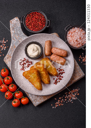 Hash browns with potatoes and onions, salt and spices Hash browns with potatoes and onions, salt and spices 124311330