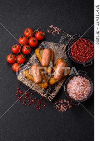 Hash browns with potatoes and onions, salt and spices Hash browns with potatoes and onions, salt and spices 124311426