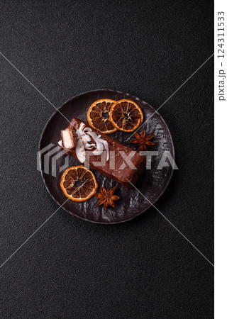 Piece of sweet chocolate bounty cake with coconut flakes and sponge Piece of sweet chocolate bounty cake with coconut flakes and sponge 124311533