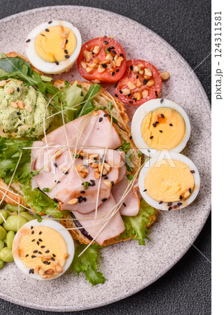 Healthy breakfast consisting of boiled eggs, slices of ham, tomatoes, green beans, aioli sauce Healthy breakfast consisting of boiled eggs, slices of ham, tomatoes, green beans, aioli sauce 124311581