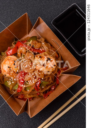 Glass noodles with shrimps and seafood, vegetables, spices and soy sauce Glass noodles with shrimps and seafood, vegetables, spices and soy sauce 124311646