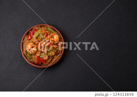 Glass noodles with shrimps and seafood, vegetables, spices and soy sauce Glass noodles with shrimps and seafood, vegetables, spices and soy sauce 124311659