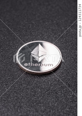 Ethereum cryptocurrency dummy in the form of a round iron coin 124311734