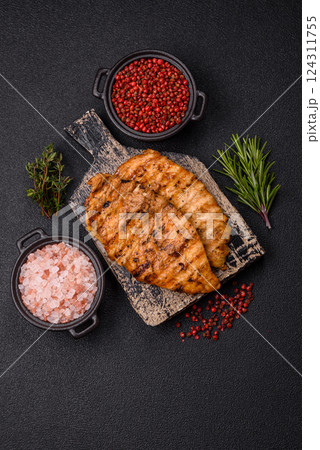 Delicious fresh grilled chicken fillet with spices and herbs 124311755