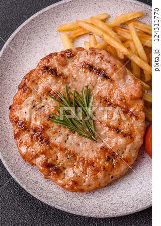 Delicious fresh grilled turkey fillet with spices and herbs 124311770