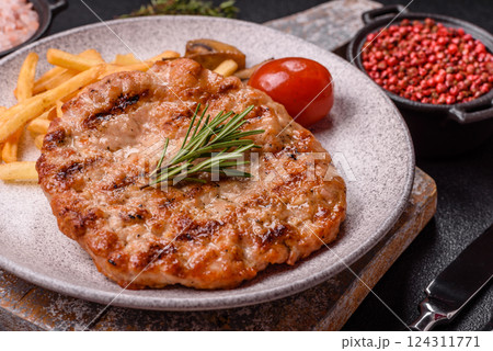 Delicious fresh grilled turkey fillet with spices and herbs 124311771