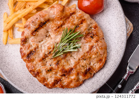 Delicious fresh grilled turkey fillet with spices and herbs Delicious fresh grilled turkey fillet with spices and herbs 124311772