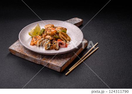 Rice with shrimps and seafood, vegetables, spices and soy sauce Rice with shrimps and seafood, vegetables, spices and soy sauce 124311790