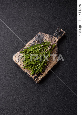 Fresh green rosemary sprigs prepared for cooking 124311820
