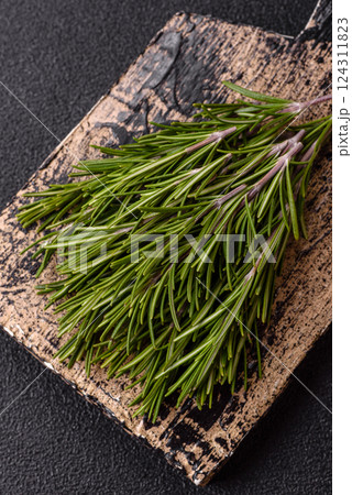Fresh green rosemary sprigs prepared for cooking Fresh green rosemary sprigs prepared for cooking 124311823