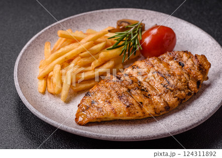 Delicious fresh grilled chicken fillet with spices and herbs 124311892