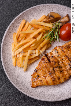 Delicious fresh grilled chicken fillet with spices and herbs Delicious fresh grilled chicken fillet with spices and herbs 124311894